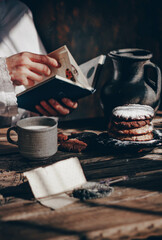 Delicious oatmeal chocolate chip cookies on a wooden table. Cozy atmosphere of the home.