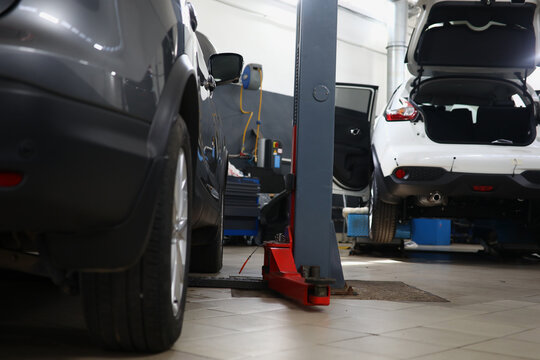 Car repair station with cars and lifts