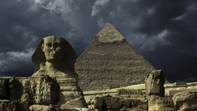 Great pyramid and sphinx and dark storm clouds in Giza Cairo, Egypt, 4k