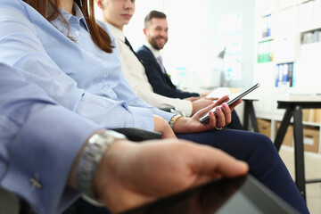 Business people sit in row at business conference