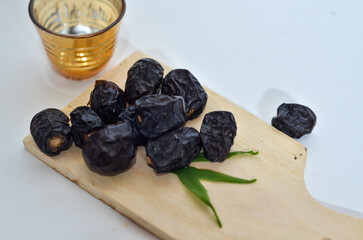 Ajwa dates or kurma ajwa are one of the special fruits of Ramadan. isolated on white background