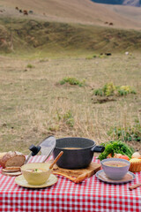 Soup and fresh produce on the outdoor table