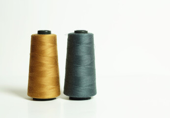 two spools of cotton thread