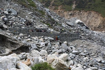 Rudarprayag, Uttarakhand, India, June 17 2014,Laborer building safety wall after Kedarnath...