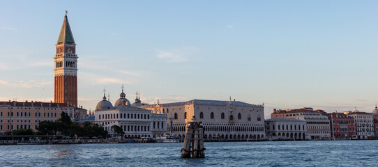 Sundown view of St. Mark's Square in Venice with bell tower and Palazzo Ducale from San Giorgio...