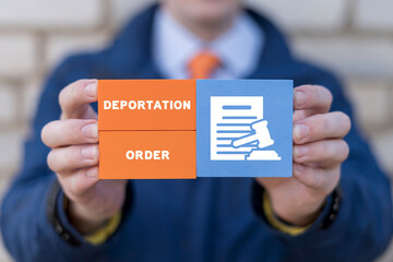 Man holding colorful blocks with inscription: DEPORTATION ORDER. Concept of deportation, asylum...
