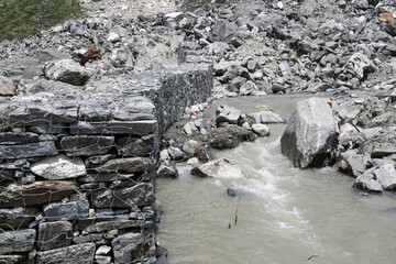 Rudarprayag, Uttarakhand, India, June 17 2014,Laborer building safety wall after Kedarnath...