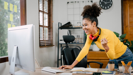 Using desktop pc, Young female african american woman working with financial statement at home, housewife manage family budget concept