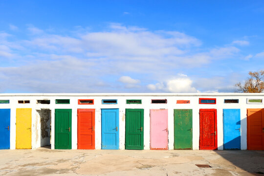 Colorful changing cabins, landmark on beach Jadrija, in Sibenik, Croatia.