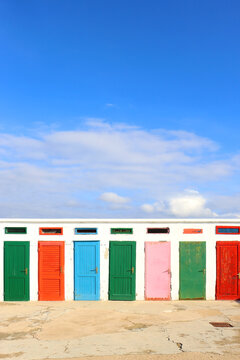 Colorful changing cabins, landmark on beach Jadrija, in Sibenik, Croatia.
