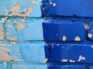 brick wall painted in different bright colors.