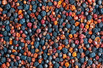 Homemade dried wild berries in background, closeup, top view. Food background. Healthy food, mix of...