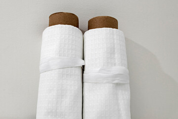 White cotton Fabric Rolls Mockup. Pieces of textile tied with ribbons
