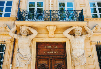 A stunning view of the Tribunal de Commerce in Aix-en-Provence, France. Admiring its detailed...