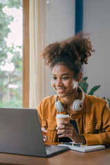 Using laptop pc, Young african american university foreign exchange students study online on laptop...