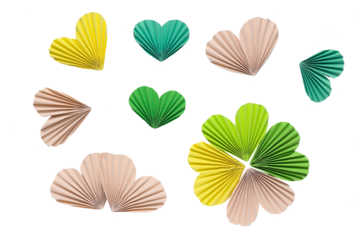 Paper accordion hearts and clover in green, yellow and beige colors on a transparent background. Spring inspiration and decoration for your collage, artwork.