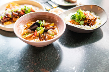 bowl of hot and delicious seafood soup on table