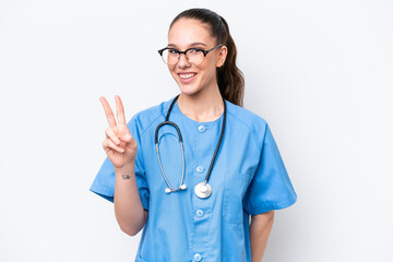 Young caucasian surgeon doctor woman isolated on white background smiling and showing victory sign