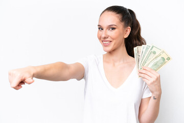 Young caucasian woman taking a lot of money isolated on white background giving a thumbs up gesture