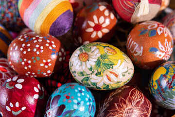 Close-up view from the top of the Easter eggs painted in various patterns.
