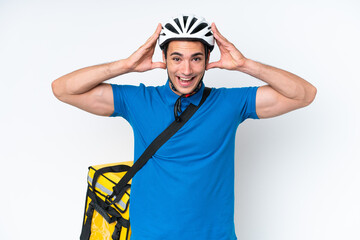 Young caucasian man with thermal backpack isolated on white background with surprise expression