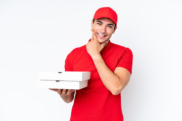 Pizza delivery caucasian man with work uniform picking up pizza boxes isolated on white background...