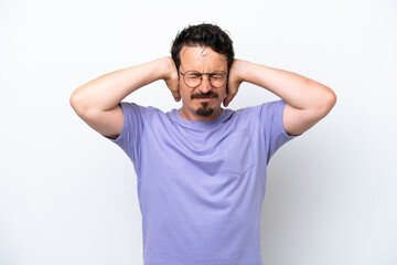 Obraz premium Young man with moustache isolated on white background frustrated and covering ears