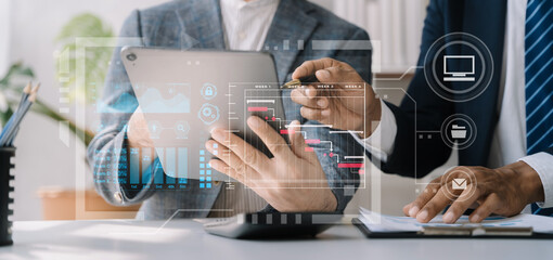 Business team hand Project manager working and update tasks and Gantt chart scheduling virtual diagram.with smart phone, tablet and laptop in office.