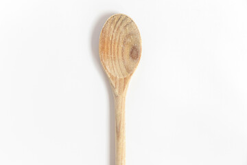 Wooden kitchen utensils. Wooden spoon used in the kitchen isolated over white background. Top view.