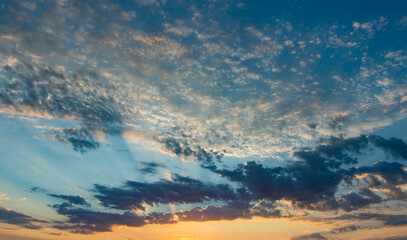 Fototapeta na wymiar Panoramic Sunrise Sky & Clouds With Light Rays Shooting Out 