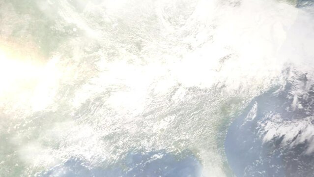 Earth zoom in from outer space to city. Zooming on Madison, Alabama, USA. The animation continues by zoom out through clouds and atmosphere into space. Images from NASA