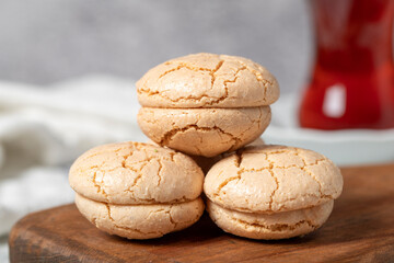 Almond cookies. Cookies made with almond flour on a stone background. Local name acibadem kurabiye. Patisserie sweets. Close up