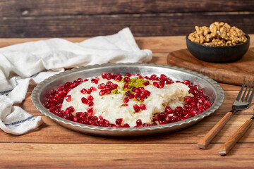 Gullac dessert. Milky dessert made special for the month of Ramadan. Traditional Turkish cuisine delicacies. gullac dessert on a copper plate