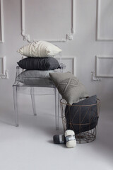 Beautiful knitted light pillows and balls of thread for knitting