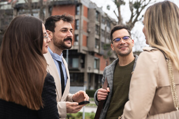 Young happy confident businesspeople, owners of a small company and a new business, satisfied and motivated go to a meeting with a large corporation. Economic and marketing experts go to office work