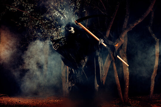 Portrait of grim reaper, the angel of death ( Azrael ) lurking through the woods at night surrounded with mist, smoke in a mystical forest holding his shythe.