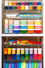 Paints, pencils, plasticine and various material for creativity and kids art activity in containers...