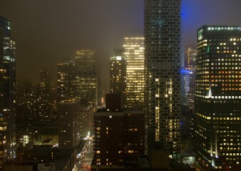 Fototapeta na wymiar Foggy Manhattan at night