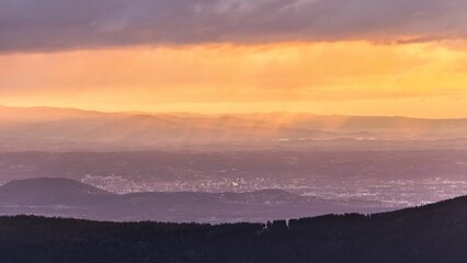 Dramatic Morning view over Graz in Austria during sunrise with some fog and clouds