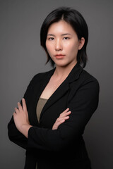 Portrait of an Asian woman wearing a suit. young business woman concept