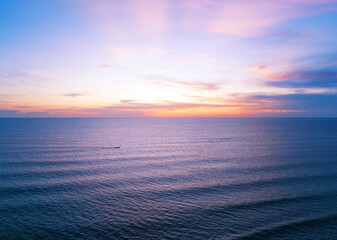 Obraz premium Aerial view sunset sky, Nature beautiful Light Sunset or sunrise over sea, Colorful dramatic majestic scenery Sky with Amazing clouds and waves in sunset sky purple light cloud background