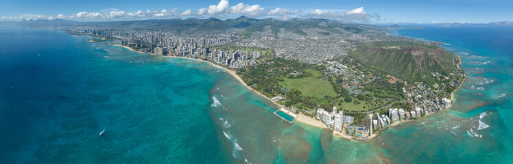 Fototapeta na wymiar Honolulu city with blue sky and clouds