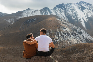 Loving couple in front of mountains
