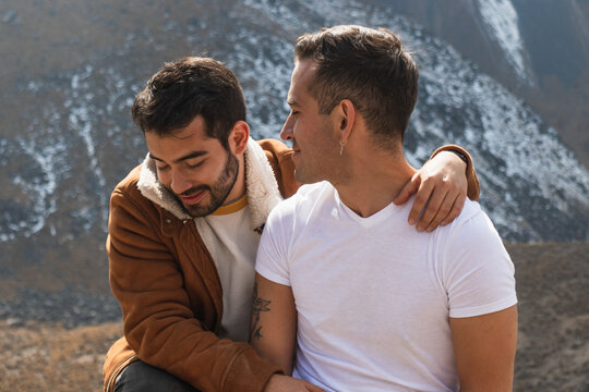 Loving couple in front of mountains - Powered by Adobe