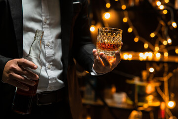 Businessman pouring whiskey victory drink - obrazy, fototapety, plakaty