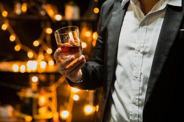 Businessman pouring whiskey victory drink