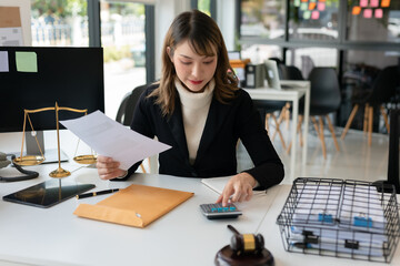Lawyers Asiawoman   having through online Concepts  of Legal services at the law office.