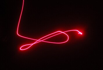 red ribbon light abstract art, moving car or plane, technology 