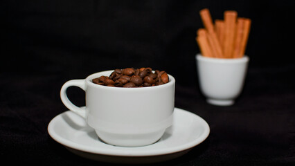 A cup of aromatic fresh natural coffee beans