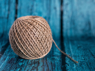 A skein or cake of jute rope roll. Ball of strings.